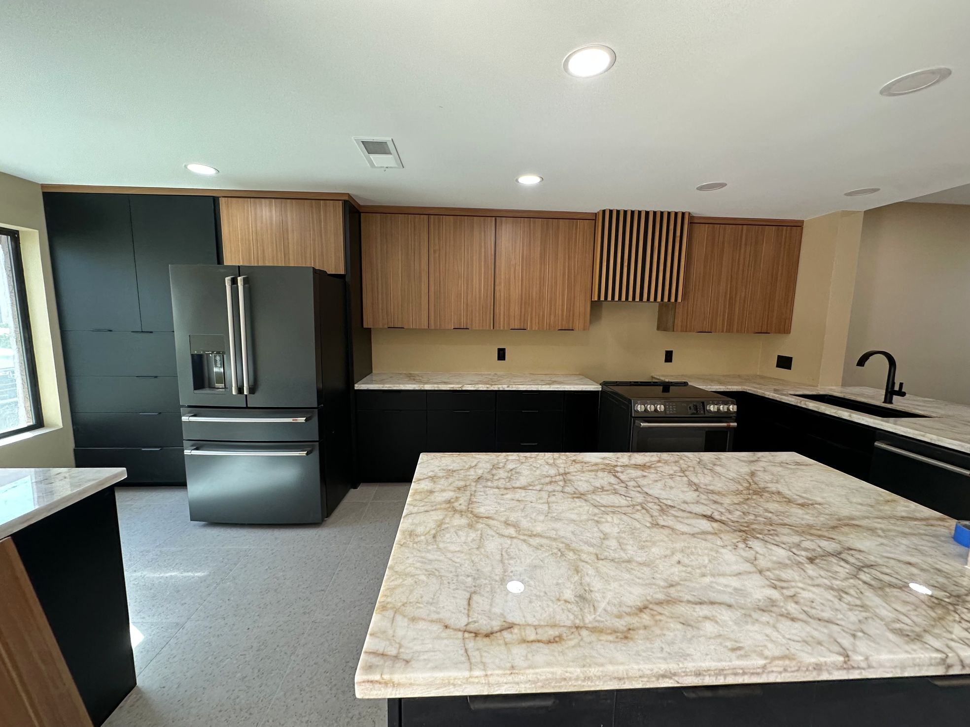 Granite countertop paired with wood cabinets