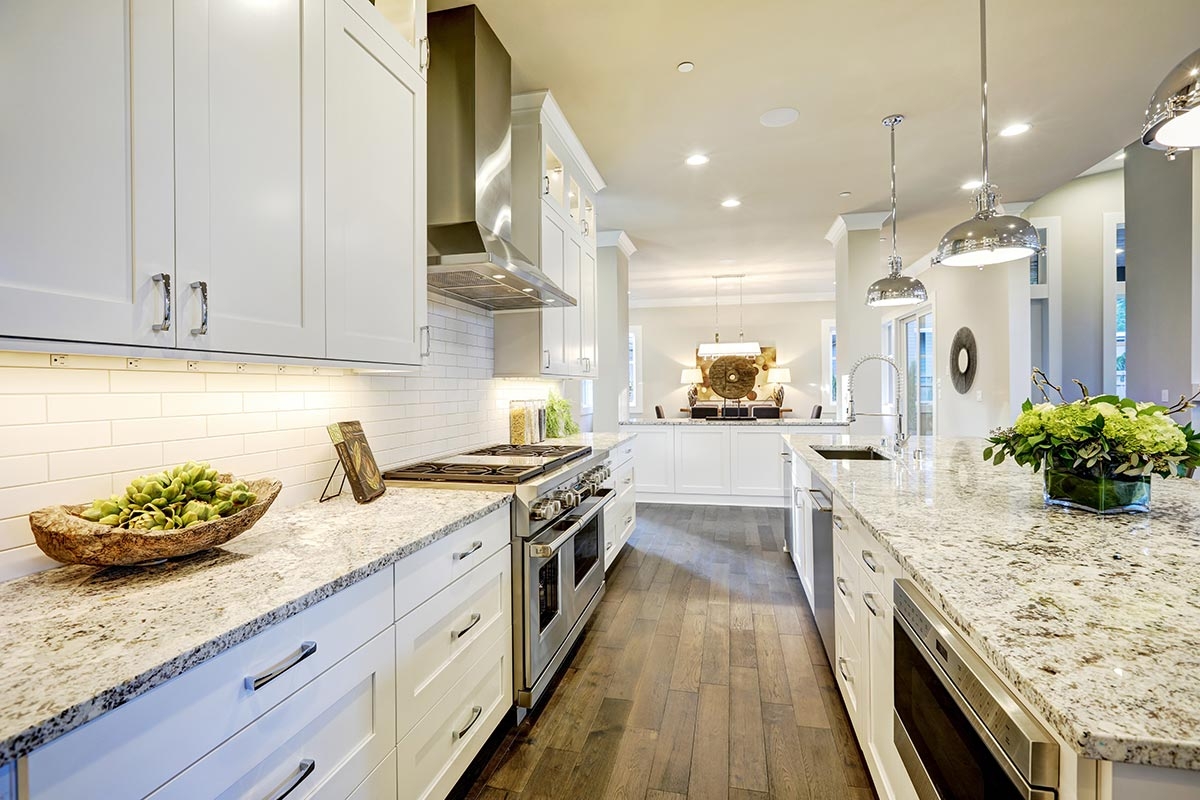 White kitchen finished with granite countertops