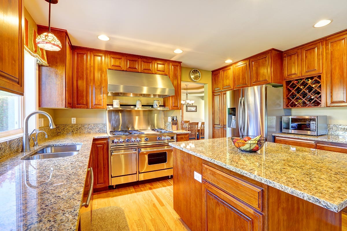 Grey granite countertops finished around a kitchen island