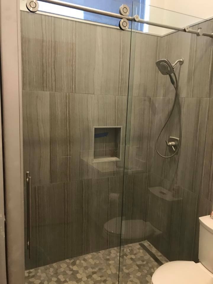 Detail of the tiled shower wall and trim in Peoria